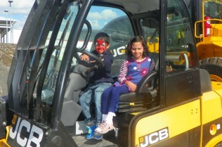 Children enjoying vehicle display