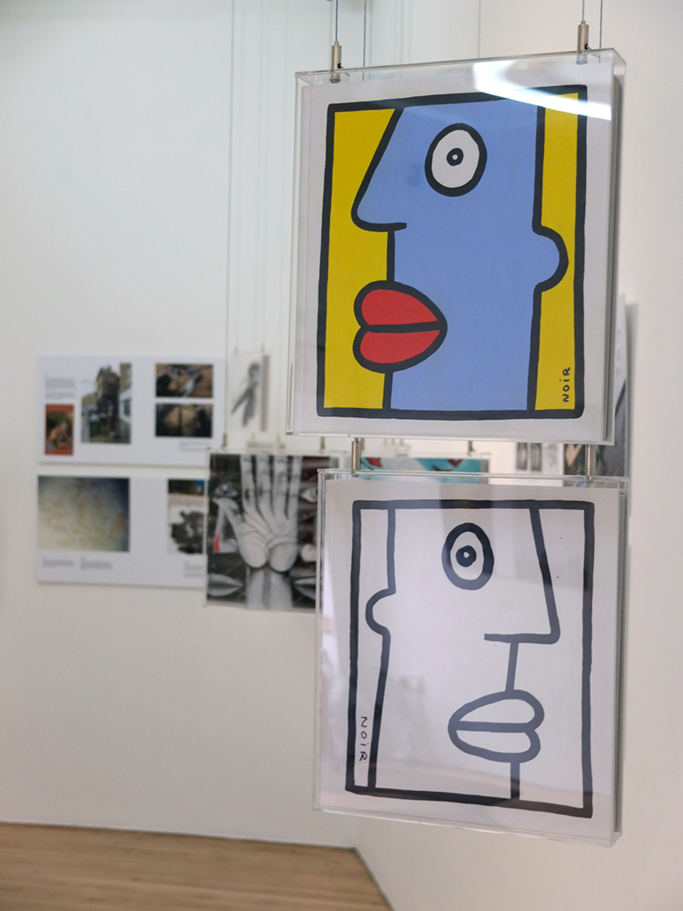Books painted by Thierry Noir and RUN for the Street Art Book Art show