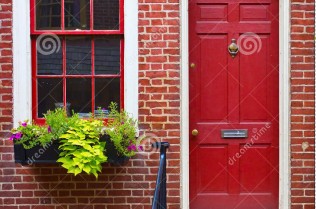 colorful-red-door-brick-wall-16735256