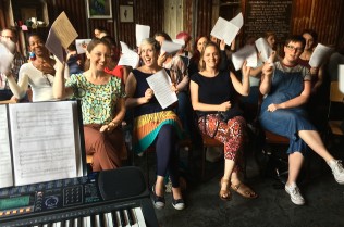 bg-cafe-choir-2-holding-scores-up